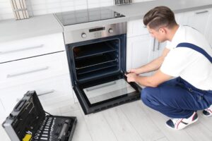 Technician servicing an oven
