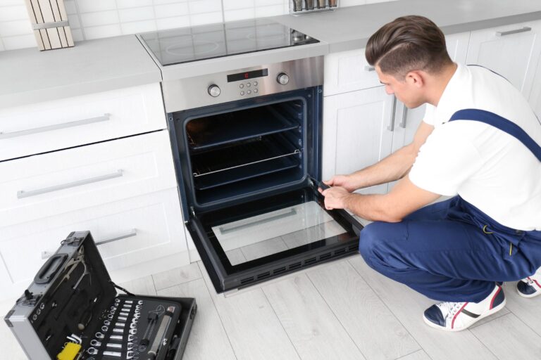 Technician servicing an oven