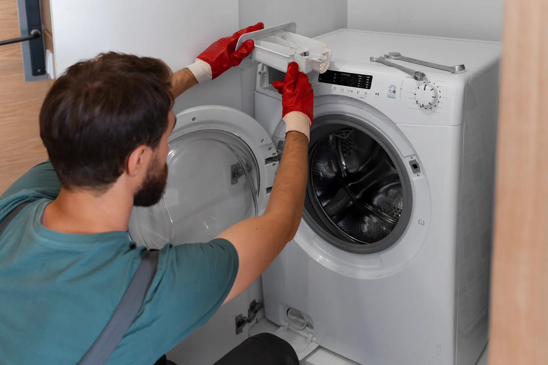 Washing machine being examined during a service visit